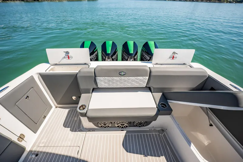 Slide: The Image of 2024 Cigarette 42' Auroris boat interior with seating and powerful outboard engines. - 63