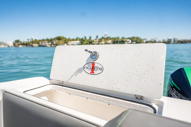 Slide: The Image of 2024 Cigarette 42' Auroris boat with open storage compartment, ocean view. - 65