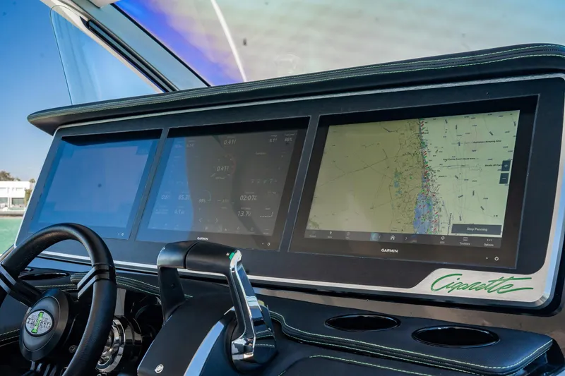 Slide: The Image of 2024 Cigarette 42' Auroris dashboard with advanced navigation screens and controls. - 7