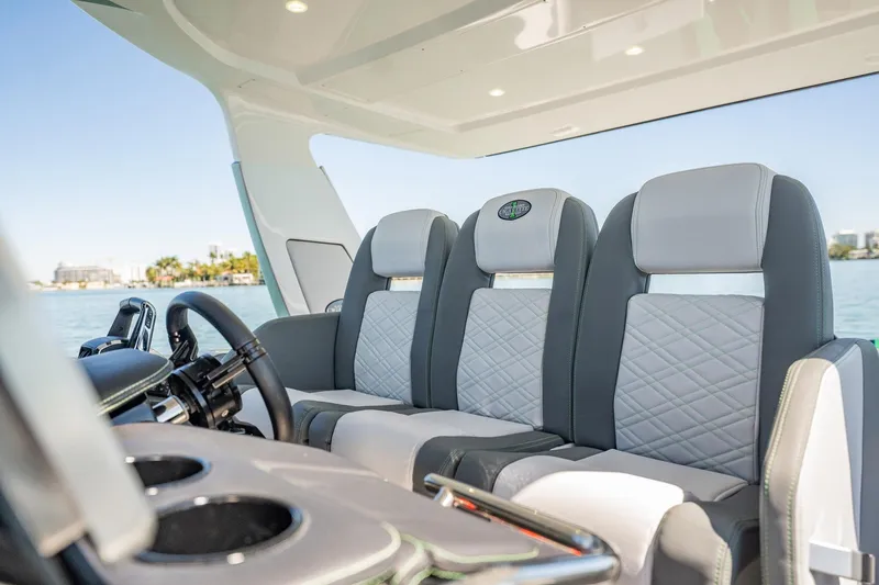 Slide: The Image of 2024 Cigarette 42' Auroris luxury boat interior with stylish seating and modern design. - 70