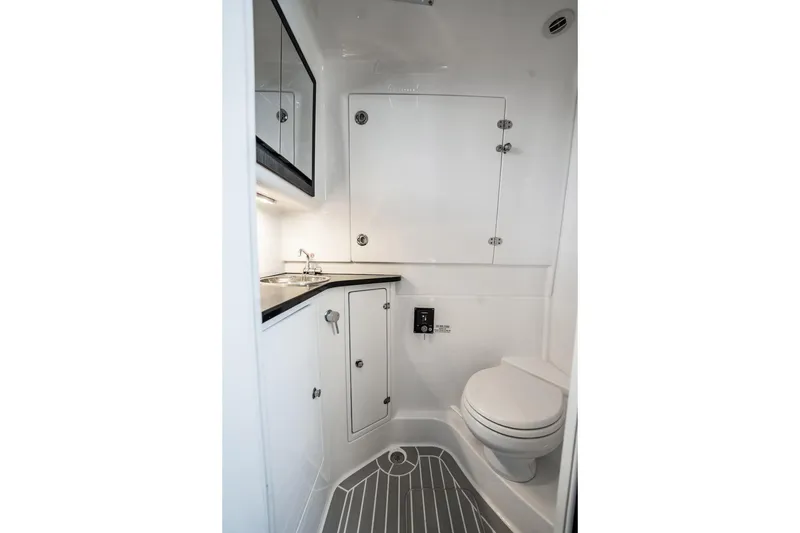 Slide: The Image of 2024 Cigarette 42' Auroris boat bathroom with modern fixtures and sleek design. - 74