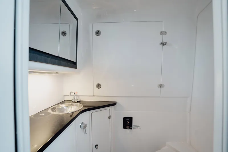 Slide: The Image of 2024 Cigarette 42' Auroris boat bathroom with sleek design and modern fixtures. - 76