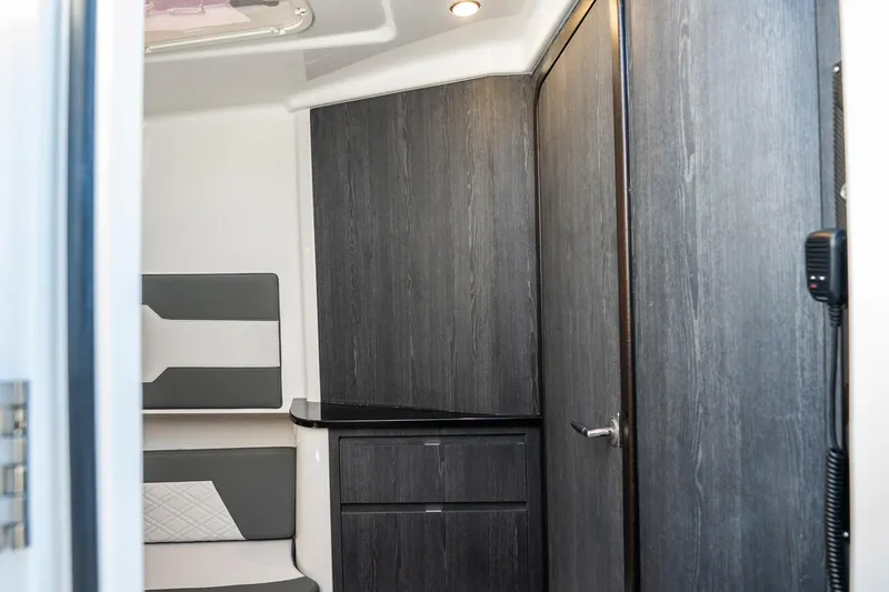 Slide: The Image of 2024 Cigarette 42' Auroris interior with sleek wood paneling and modern seating. - 78