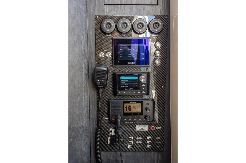 Slide: The Image of Control panel of 2024 Cigarette 42' Auroris boat with advanced audio and navigation systems. - 80