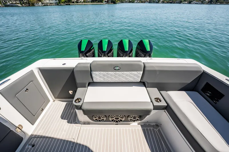 Slide: The Image of 2024 Cigarette 42' Auroris boat interior with seating and four outboard engines. - 86