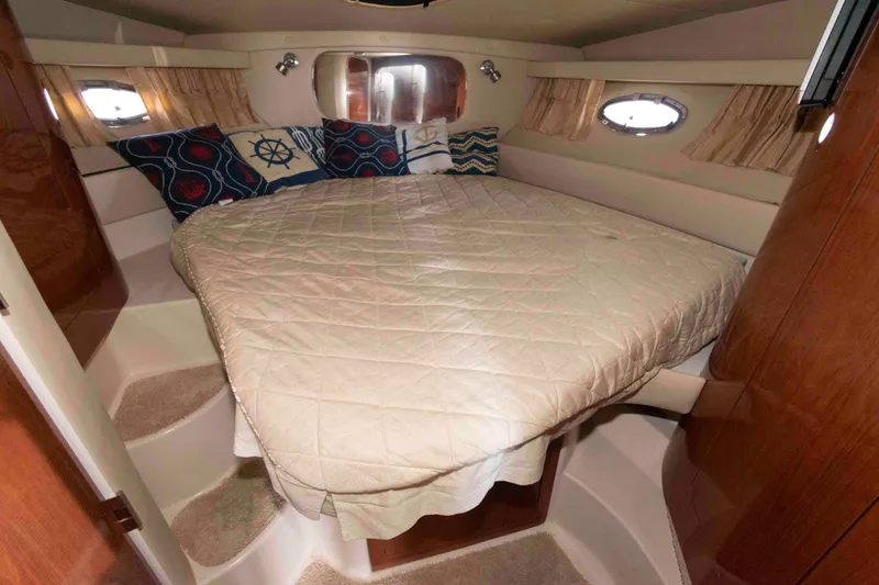 Slide: The Image of Luxurious cabin interior of 2005 Regal Commodore 3880 yacht with cozy bedding. - 13