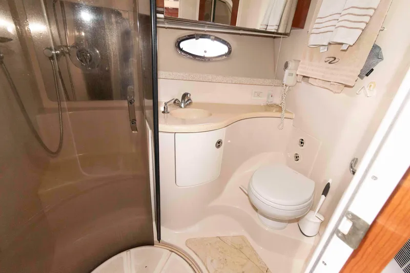 Slide: The Image of Bathroom interior of 2005 Regal Commodore 3880 yacht with shower and toilet. - 14