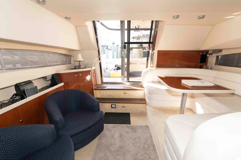 Slide: The Image of Luxurious interior of 2005 Regal Commodore 3880 yacht with elegant seating and dining area. - 15