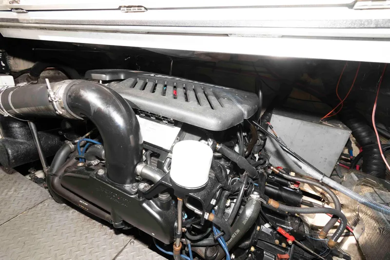 Slide: The Image of Engine compartment of a 2005 Regal Commodore 3880 boat, showcasing mechanical components. - 17