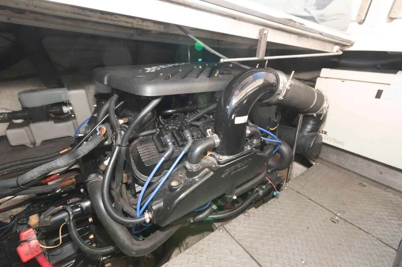 Slide: The Image of Engine compartment of a 2005 Regal Commodore 3880 boat, showcasing detailed mechanical components. - 18