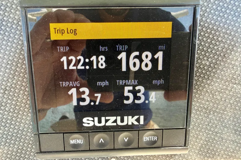 Slide: The Image of Suzuki trip log display on 2021 Pioneer 222 Islander boat, showing trip data. - 24