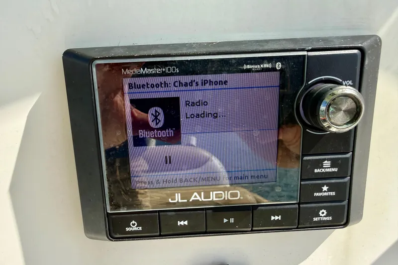 Slide: The Image of JL Audio MediaMaster 100s displaying Bluetooth connection on Pioneer 222 Islander, 2021 model. - 26