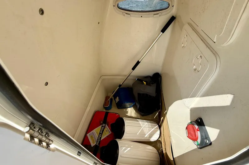 Slide: The Image of Interior storage of 2021 Pioneer 222 Islander boat with equipment and supplies. - 30