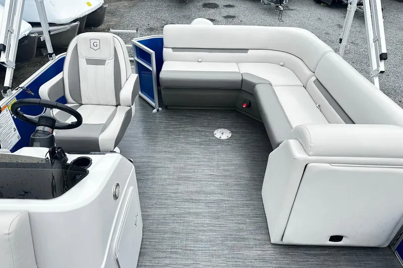 Slide: The Image of 2021 Godfrey Sweetwater 2086CX pontoon boat interior with plush seating and steering console. - 3