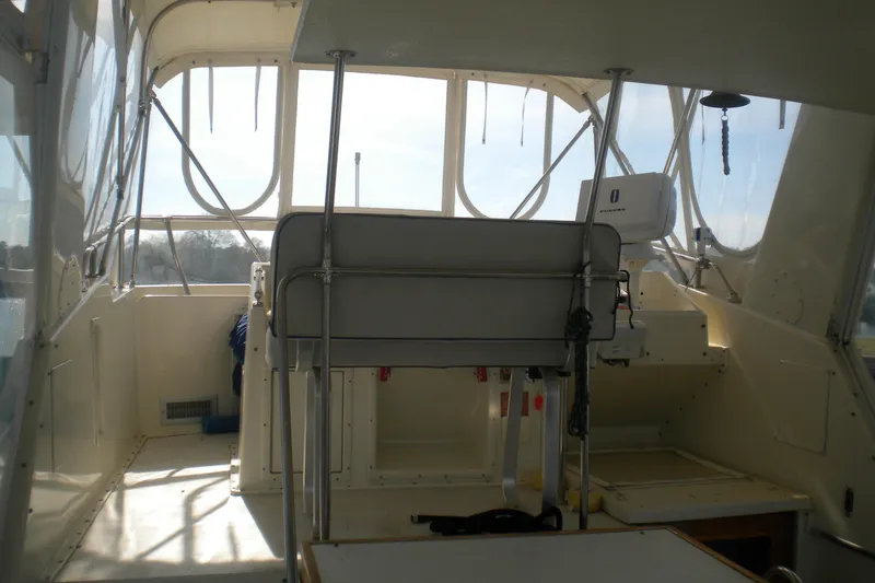 Slide: The Image of Interior view of 1987 Hatteras 40 Motor Yacht cockpit with seating and navigation equipment. - 15