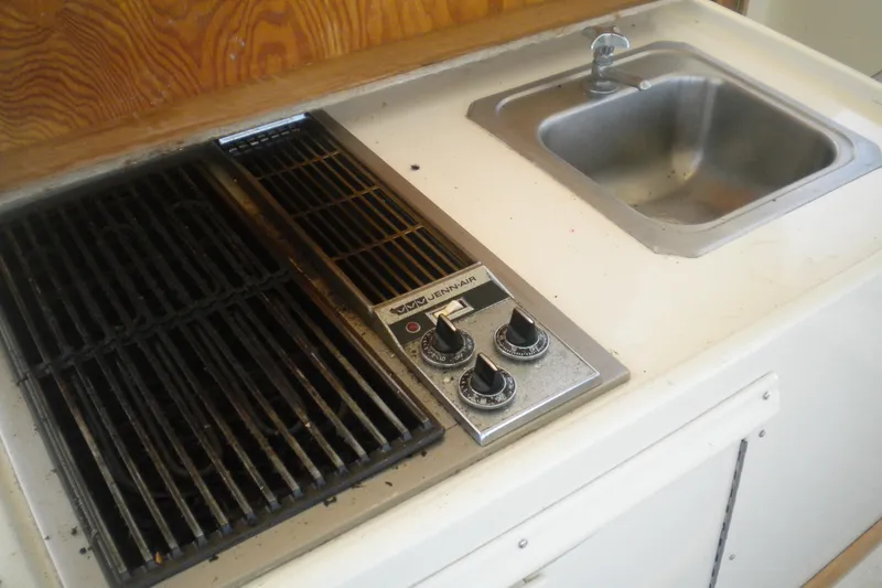 Slide: The Image of 1987 Hatteras 40 Motor Yacht kitchen with stove and sink. - 19