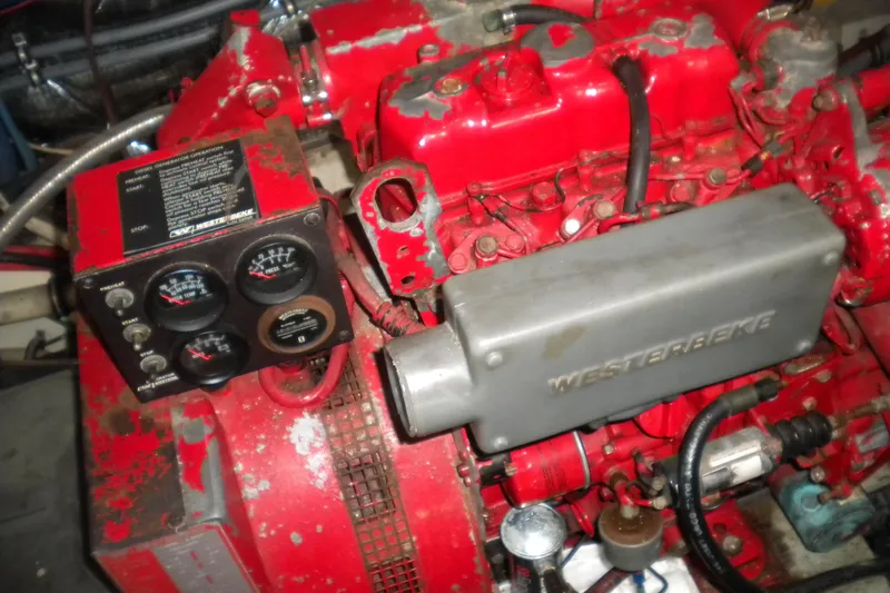 Slide: The Image of Engine compartment of a 1987 Hatteras 40 Motor Yacht with Westerbeke generator. - 45