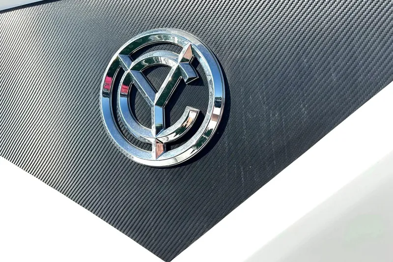 Slide: The Image of Chrome logo on 2021 Cruisers Yachts 50 Cantius, textured black background. - 105