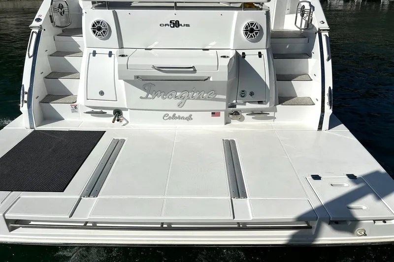 Slide: The Image of 2021 Cruisers Yachts 50 Cantius stern view with swim platform and steps. - 26