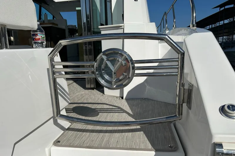 Slide: The Image of 2021 Cruisers Yachts 50 Cantius deck with stainless steel gate and modern design. - 31