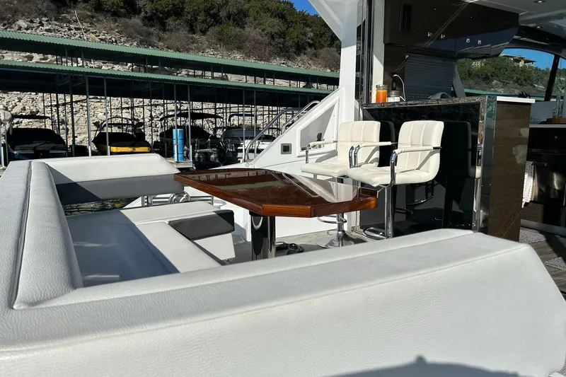 Slide: The Image of Luxurious 2021 Cruisers Yachts 50 Cantius with elegant seating and dining area. - 33