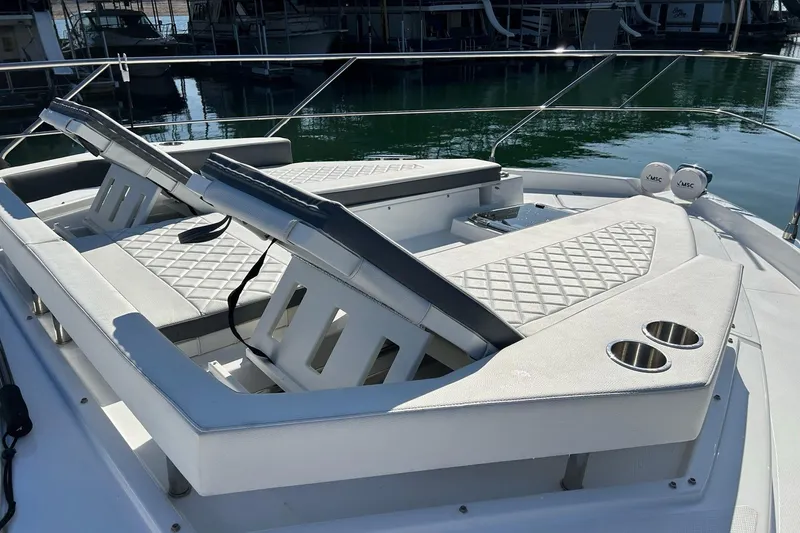 Slide: The Image of 2021 Cruisers Yachts 50 Cantius with luxurious sun loungers and cup holders on deck. - 41