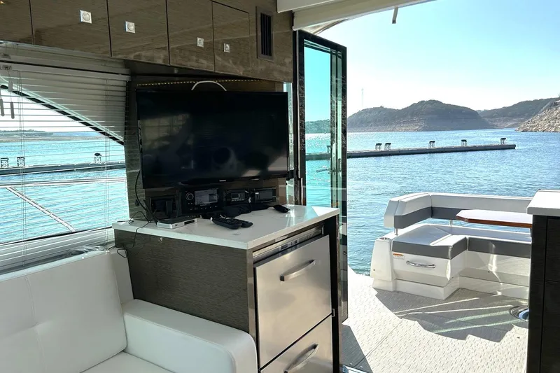 Slide: The Image of Interior of 2021 Cruisers Yachts 50 Cantius with scenic water view. - 50