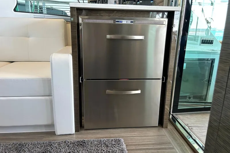Slide: The Image of Stainless steel refrigerator in 2021 Cruisers Yachts 50 Cantius interior. - 51