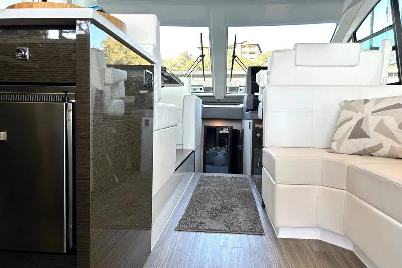 Slide: The Image of Interior of 2021 Cruisers Yachts 50 Cantius with modern seating and sleek design. - 56