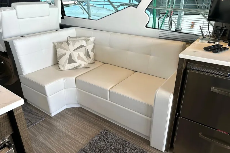 Slide: The Image of Luxurious interior of 2021 Cruisers Yachts 50 Cantius with white leather seating. - 57
