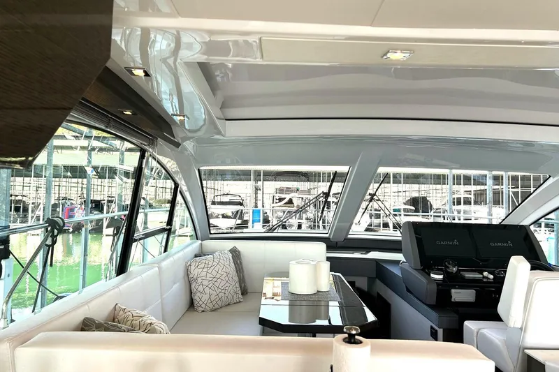 Slide: The Image of Luxurious interior of 2021 Cruisers Yachts 50 Cantius with modern seating and helm. - 58