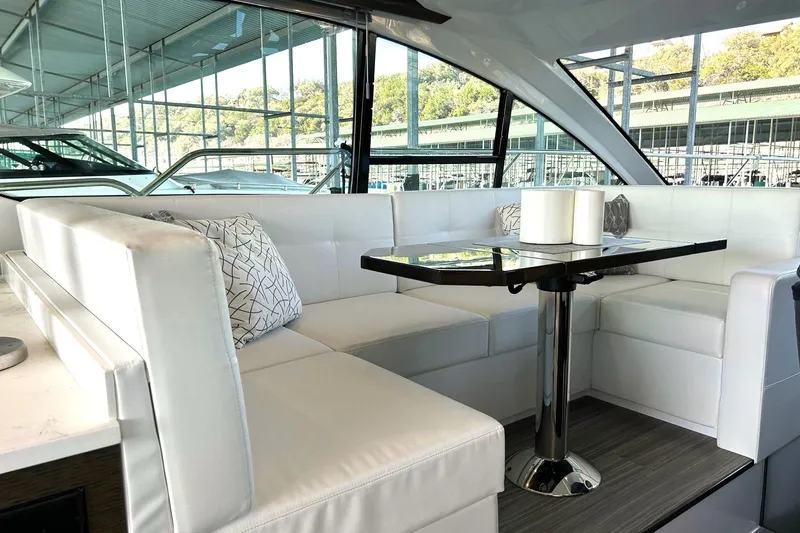 Slide: The Image of Luxurious interior of 2021 Cruisers Yachts 50 Cantius with elegant white seating and modern table. - 59