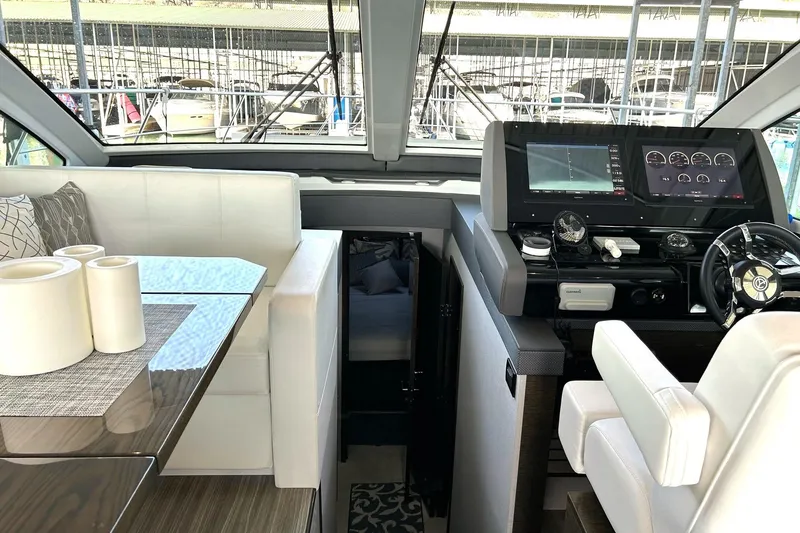 Slide: The Image of Interior of 2021 Cruisers Yachts 50 Cantius with helm and seating area. - 61