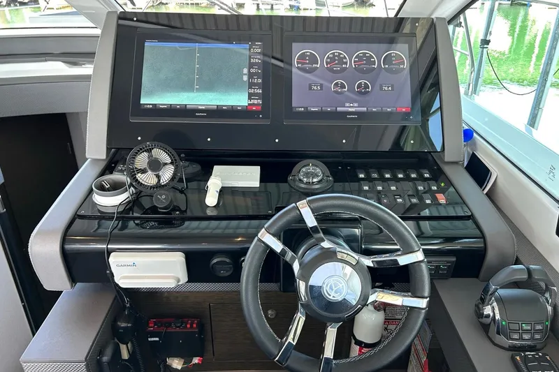 Slide: The Image of Helm of 2021 Cruisers Yachts 50 Cantius with dual displays and modern controls. - 63
