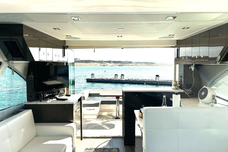 Slide: The Image of Luxurious interior of 2021 Cruisers Yachts 50 Cantius with waterfront view. - 65