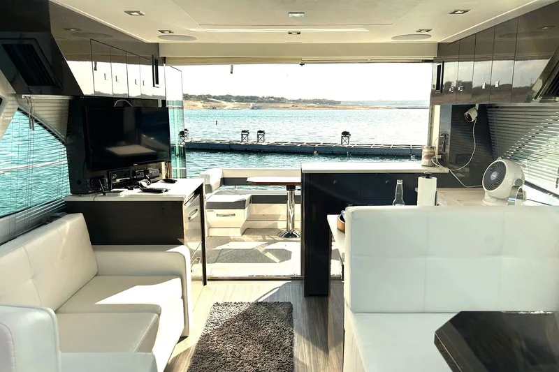 Slide: The Image of Luxurious interior of 2021 Cruisers Yachts 50 Cantius with lake view. - 7