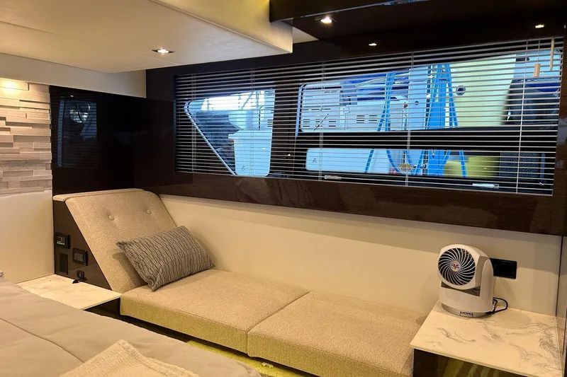 Slide: The Image of Luxurious interior of 2021 Cruisers Yachts 50 Cantius with modern seating and window blinds. - 73