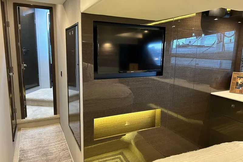 Slide: The Image of Luxurious interior of 2021 Cruisers Yachts 50 Cantius with modern TV and elegant decor. - 76