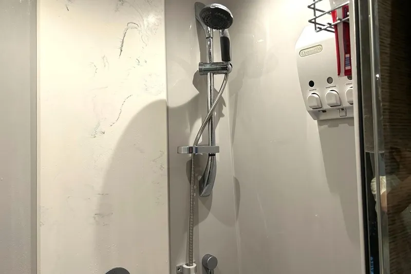 Slide: The Image of Shower area in 2021 Cruisers Yachts 50 Cantius with dispenser and handheld showerhead. - 82