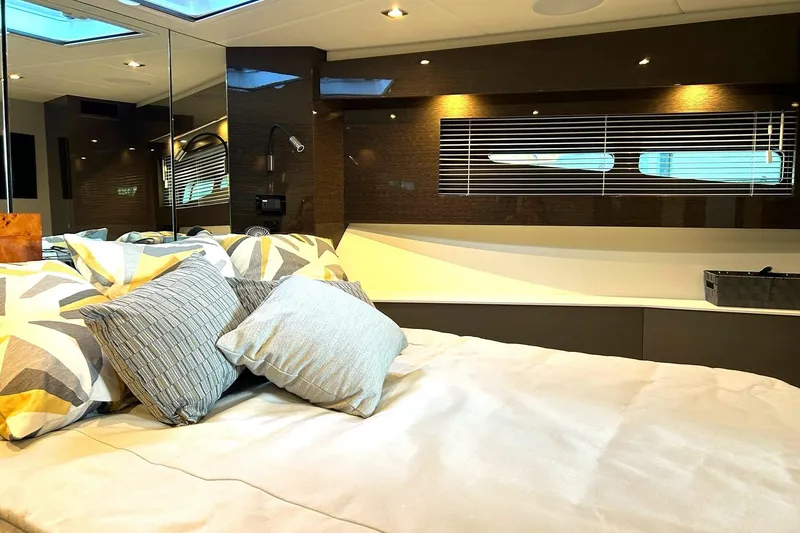 Slide: The Image of Luxurious bedroom interior of 2021 Cruisers Yachts 50 Cantius with modern decor and pillows. - 84