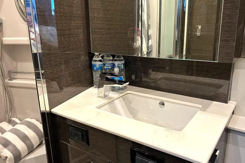 Slide: The Image of Luxurious bathroom vanity in 2021 Cruisers Yachts 50 Cantius with modern sink and mirror. - 89