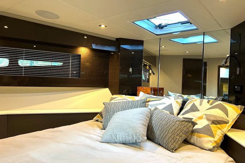 Slide: The Image of Luxurious interior cabin of 2021 Cruisers Yachts 50 Cantius with stylish bedding and skylight. - 9