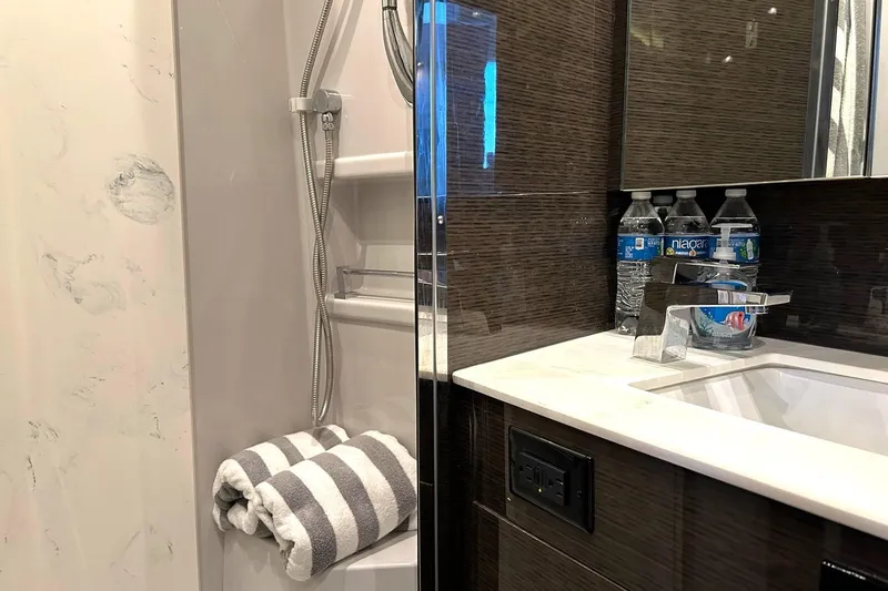 Slide: The Image of Luxurious bathroom in 2021 Cruisers Yachts 50 Cantius with modern fixtures and amenities. - 90