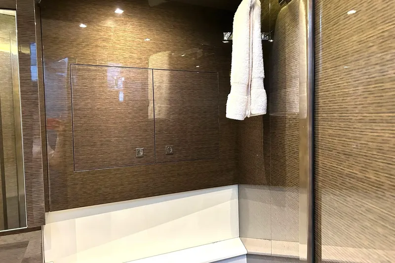 Slide: The Image of Luxurious bathroom interior of 2021 Cruisers Yachts 50 Cantius with wood paneling and towel. - 92
