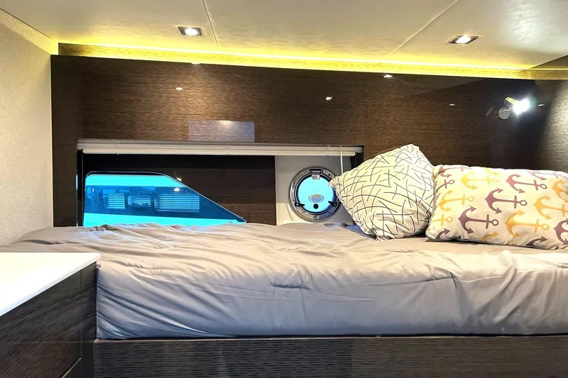 Slide: The Image of Luxurious 2021 Cruisers Yachts 50 Cantius cabin interior with cozy bedding and modern design. - 94