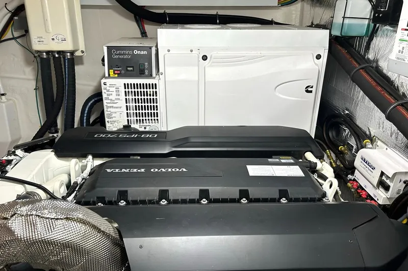 Slide: The Image of Engine room of 2021 Cruisers Yachts 50 Cantius with Volvo Penta engine and Cummins Onan generator. - 96