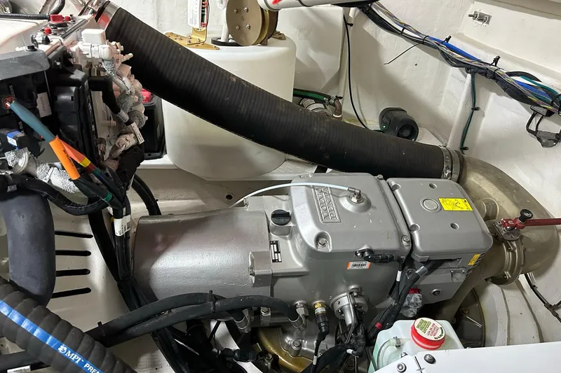 Slide: The Image of Engine room of 2021 Cruisers Yachts 50 Cantius, showcasing mechanical components and wiring. - 98