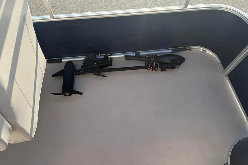 Slide: The Image of 2015 SunChaser 22 vs boat interior with motor parts on deck. - 10