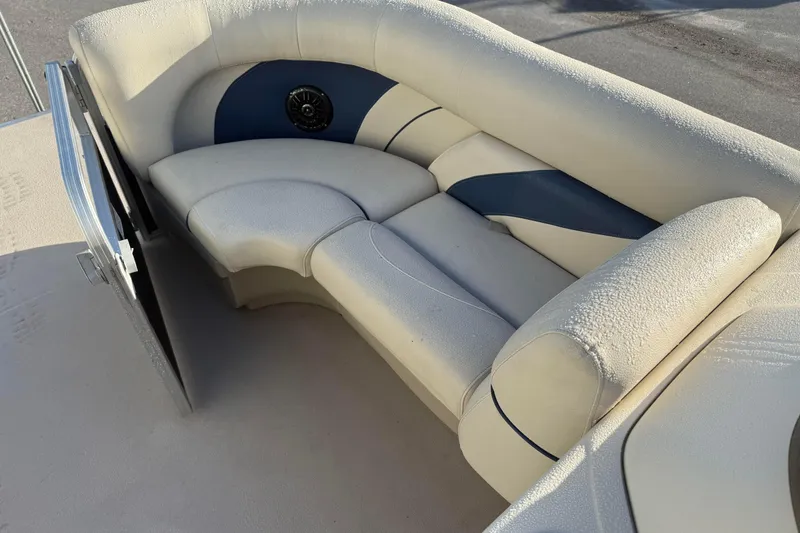 Slide: The Image of Luxurious seating on a 2015 SunChaser 22 VS boat, featuring plush upholstery. - 15