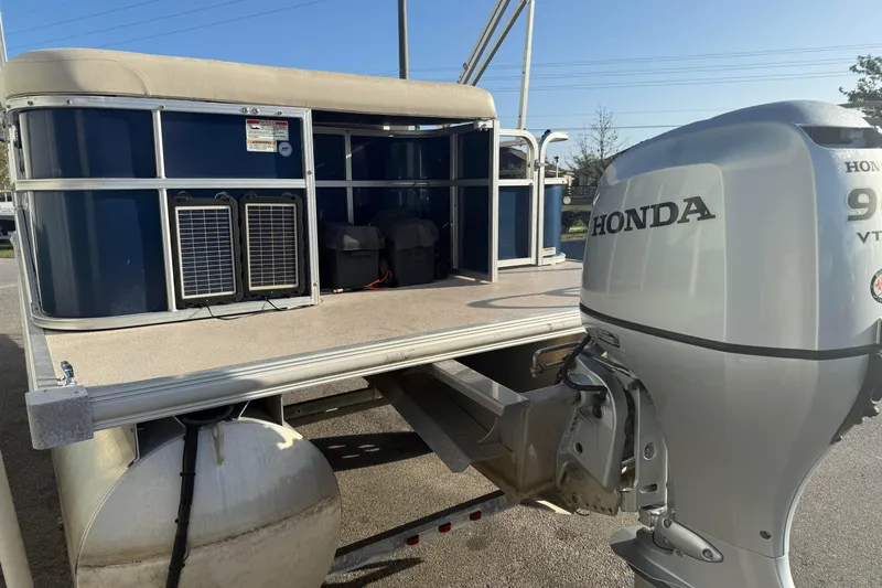 Slide: The Image of 2015 SunChaser 22 vs pontoon boat with Honda 90 VTEC outboard motor. - 3